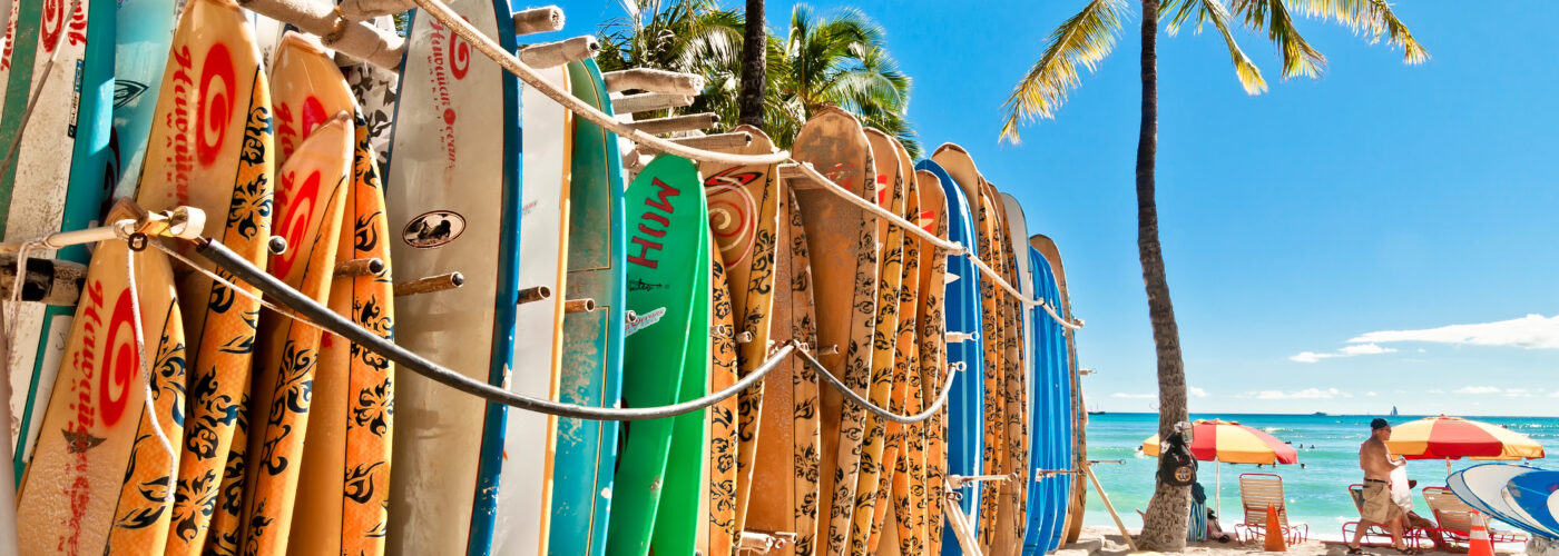 Surfboards lined up on the beach in Waikiki, Honolulu, Hawaii