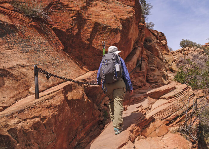 angels landing hiker in zion national park.